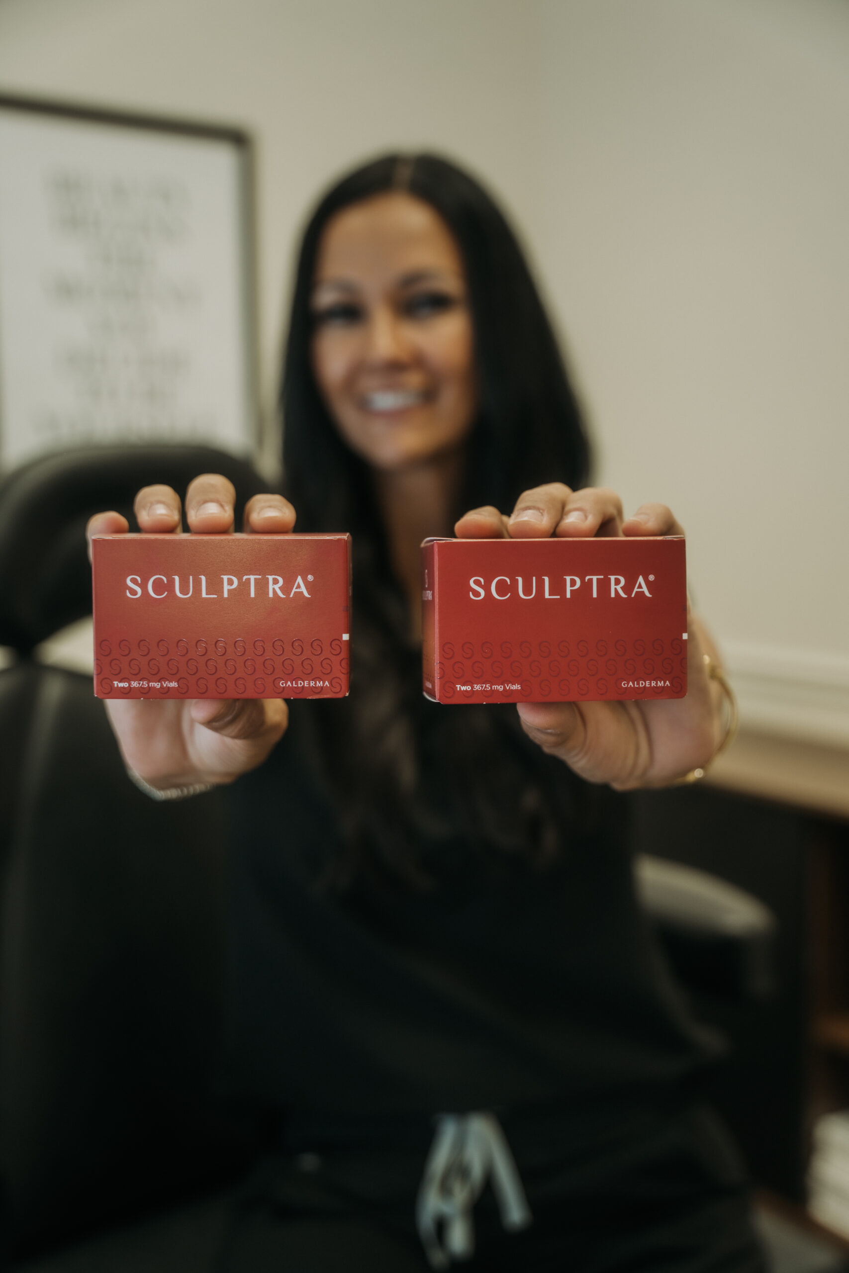 Revival provider presenting Sculptra injectable products