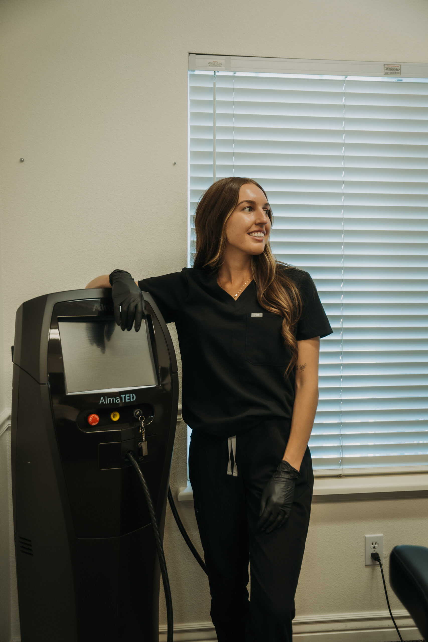 Revival provider standing beside the Alma TED hair and scalp system